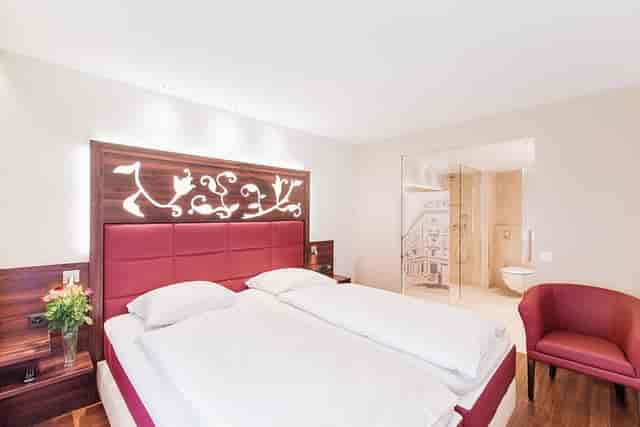 Modern Hotel Scheuble executive suite featuring open-concept layout for business travel.