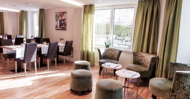 Hotel Rex conference room with lounge area for intimate business networking and strategy meetings.