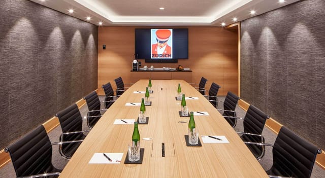 Modern boardroom at The Historic, minimalist table setting for executive corporate meetings.