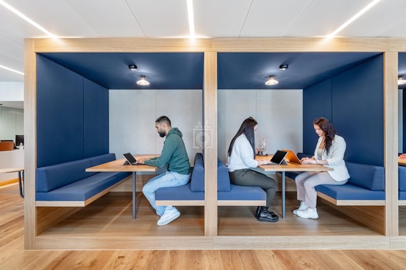 Modern coworking office with agile breakout pods for hybrid collaboration and productive meetings.
