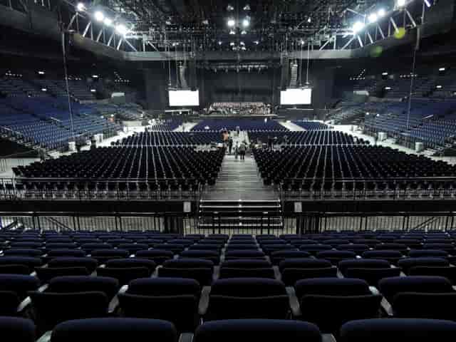 Hallenstadion Zurich arena with theater seating for large-scale plenary event and conference.