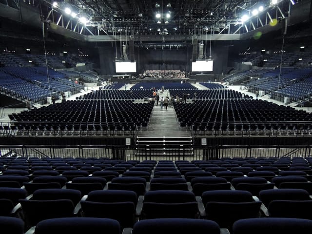 Hallenstadion Zurich arena with theater seating for large-scale plenary event and conference.