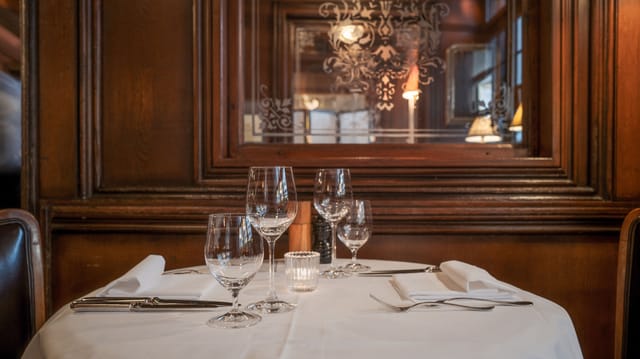 Upscale Hotel Kindli restaurant set for executive dinner and networking events.