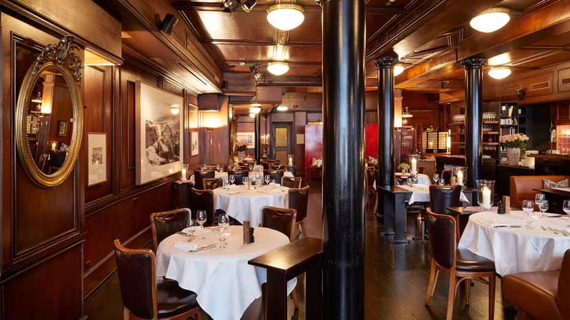Hotel Kindli restaurant, wood-paneled elegance for corporate dinner and VIP networking events.