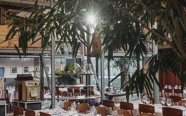 Industrial-chic Chicago event venue with biophilic design for corporate dinners and receptions.