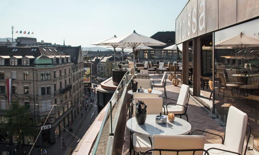 Haute rooftop restaurant terrace with city views for upscale cocktail receptions and mixers.