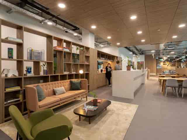 Coworking space at Spaces Ambassador House with lounge seating for networking and hybrid workshops.