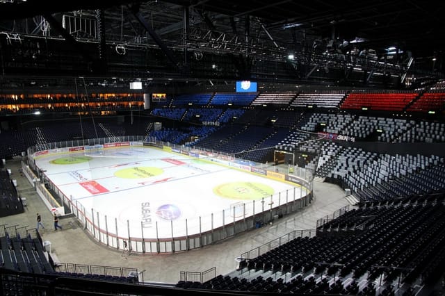 Hallenstadion arena with ice floor for gala events and experiential venue staging.