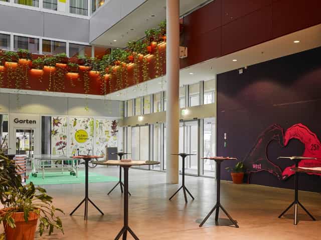 Modern atrium restaurant at 25hours Hotel Zurich for corporate networking and coffee break events.