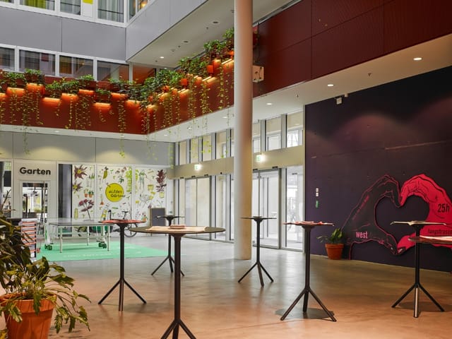 Modern atrium restaurant at 25hours Hotel Zurich for corporate networking and coffee break events.