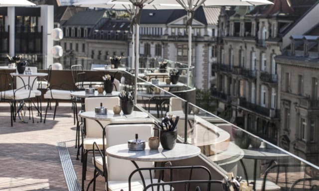 Upscale rooftop terrace for networking receptions and corporate events with city views.
