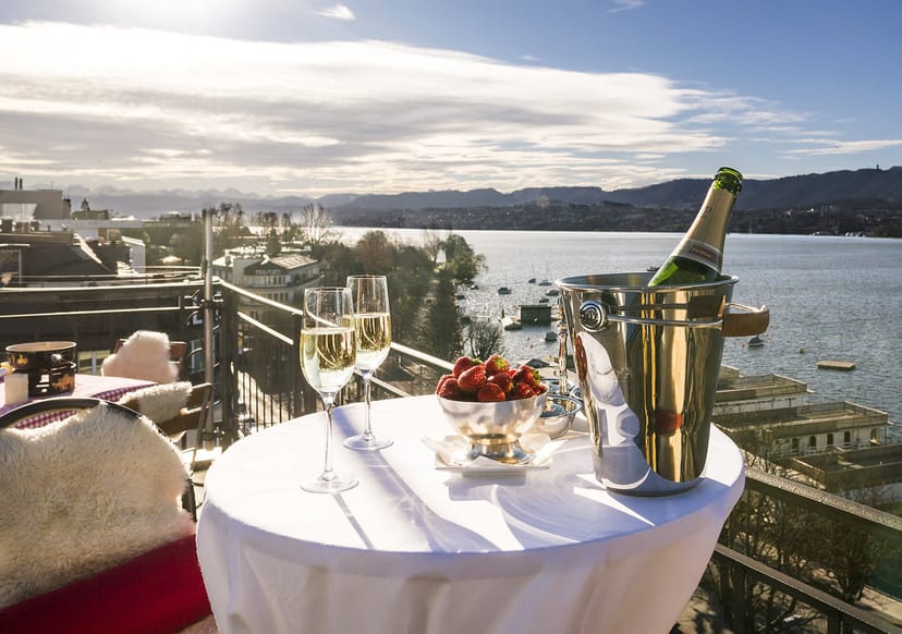 VIP networking reception at luxury waterfront rooftop terrace, ideal for executive events.