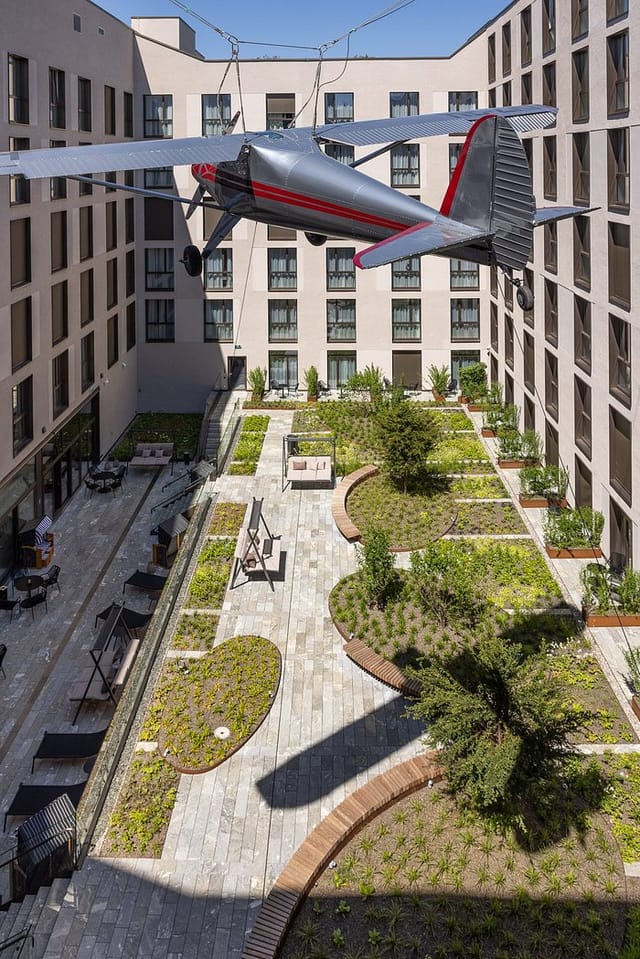 Radisson Zurich courtyard with outdoor seating, ideal for corporate networking and business events.