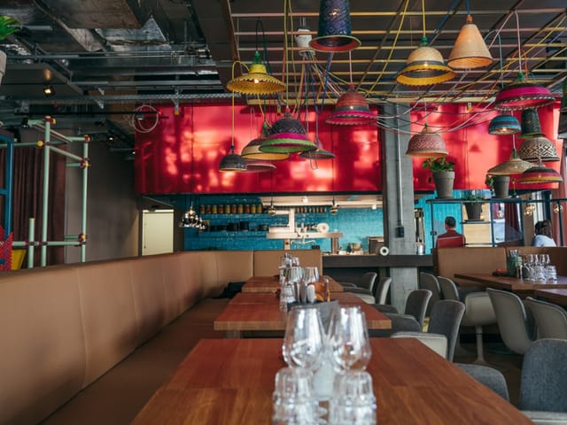 Industrial-chic bar at 25hours Hotel Zurich for networking and corporate team dinner events.