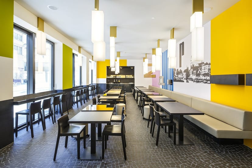 Modern meeting room with modular seating for networking and corporate breakout events.