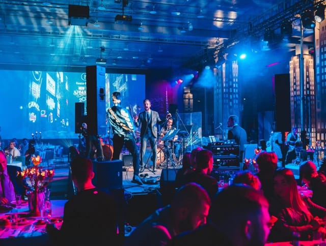 Nebula at FANTADROMS gala: vibrant live band performance and immersive stage lighting event.