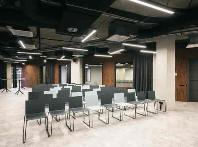 SAM hall industrial conference space with theater seating for corporate workshops and events.