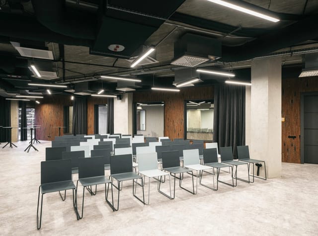 SAM hall industrial conference space with theater seating for corporate workshops and events.