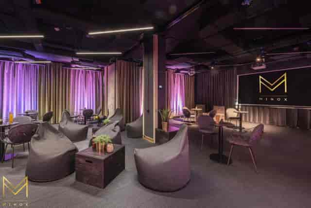 Modern Minox boardroom with beanbags and LED lighting for corporate workshops and team meetings.