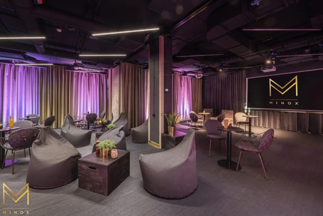Modern Minox boardroom with beanbags and LED lighting for corporate workshops and team meetings.