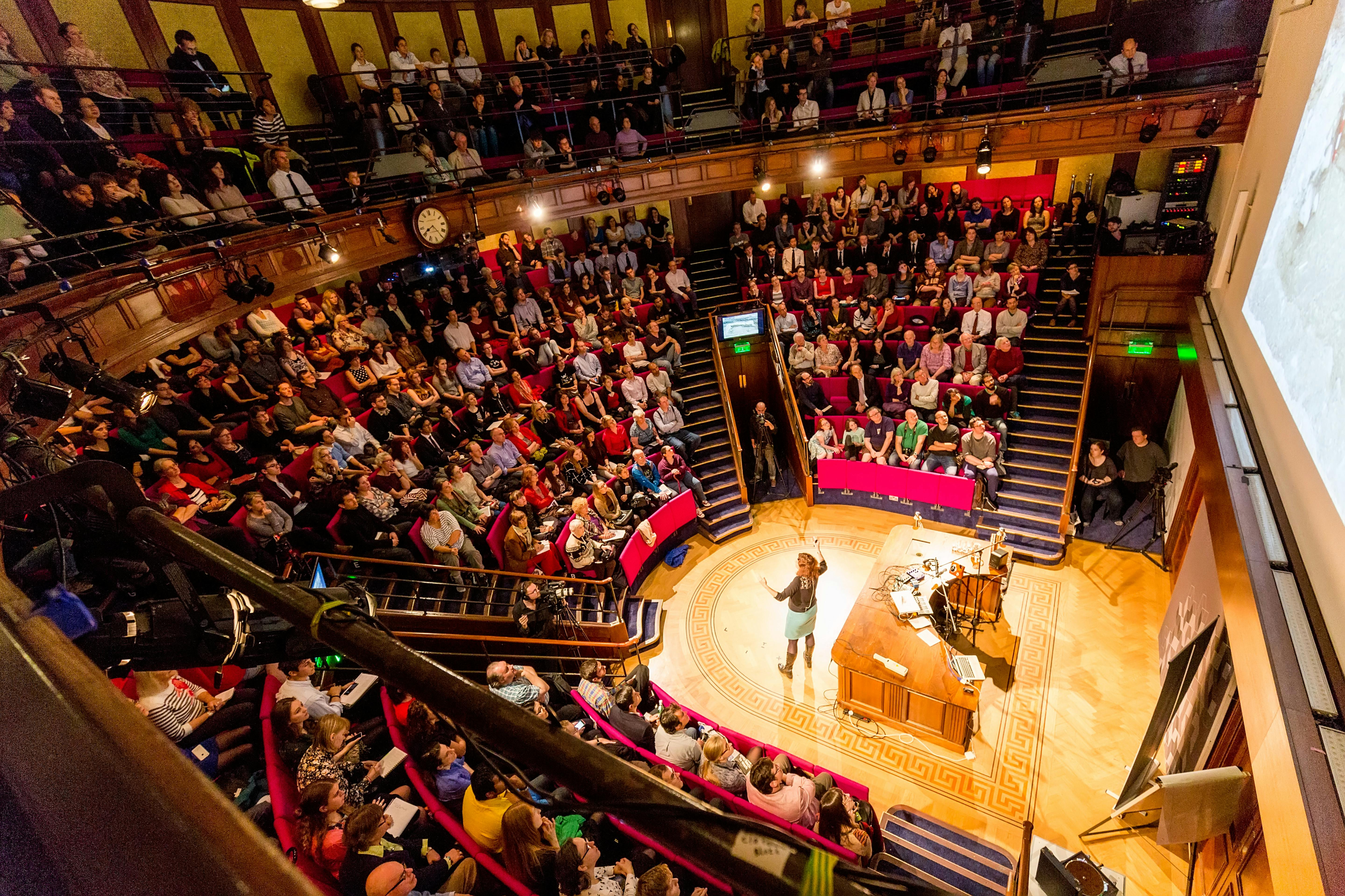 Packed auditorium at Royal Institution Theatre, showcasing engaging event and effective seating.