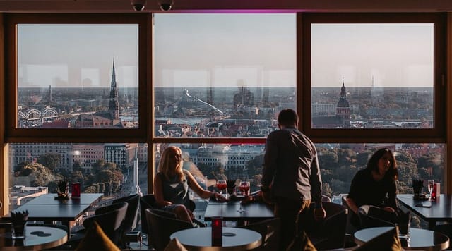 Outdoor bar in Riga with panoramic skyline views, ideal for executive networking and cocktails.