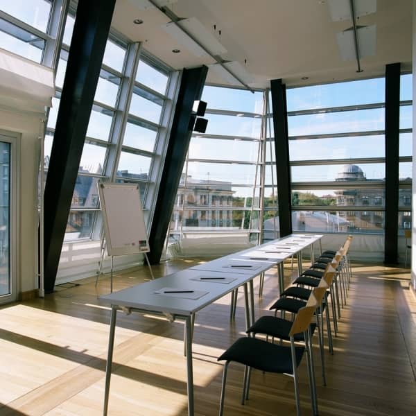 Boardroom in Hotels Bergs Suites with floor-to-ceiling windows for strategic meetings and events.