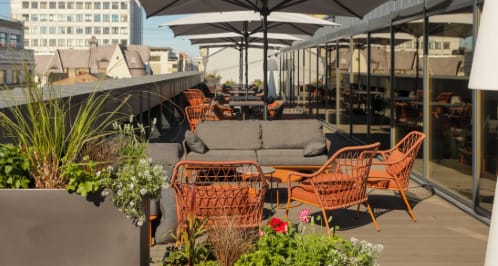 Aston Hotel Riga rooftop lounge for casual networking reception and business event.