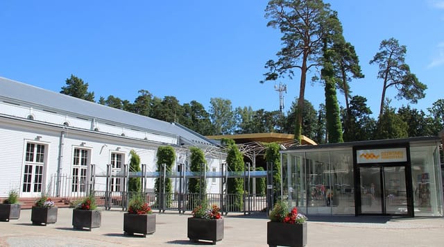 Dzintari Concert Hall: Modern glass-fronted venue for hybrid corporate events and conferences.