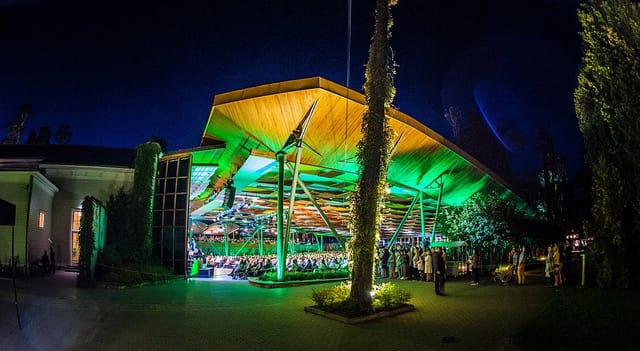 Dzintari Concert Hall green lighting for corporate event reception.