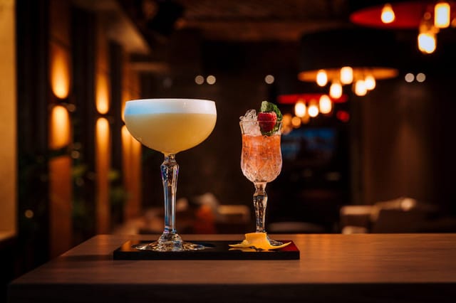 High-end corporate cocktail bar setup with premium glassware for luxury event planning.