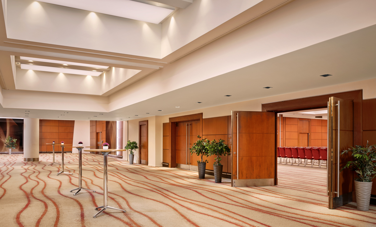 Victoria Suite at Park Plaza Victoria London, modern event space with elegant wooden doors. - Banner