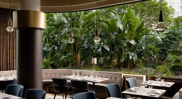 Continental restaurant venue with banquette seating for corporate breakfast and lunch events.