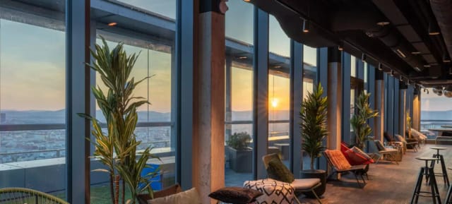 Rooftop lounge at TUtheSky with sunset view, ideal for VIP networking and corporate receptions.
