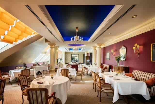 Elegant restaurant terrace lounge for VIP business meetings and private networking dinners.