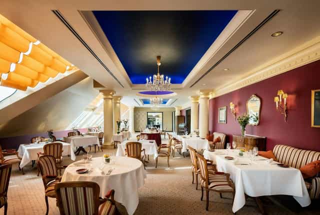 Elegant restaurant terrace lounge for VIP business meetings and private networking dinners.