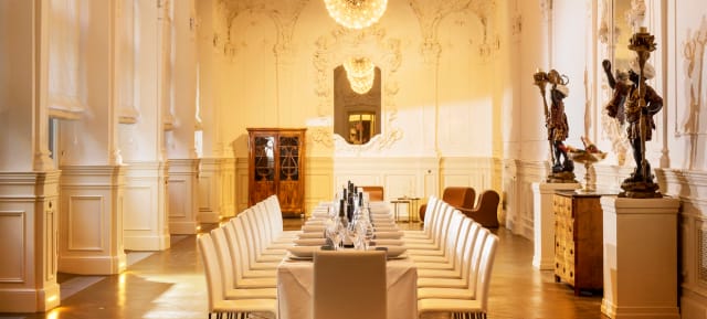 Luxury gala banquet in VIENNABallhaus main room featuring ornate historic architecture.