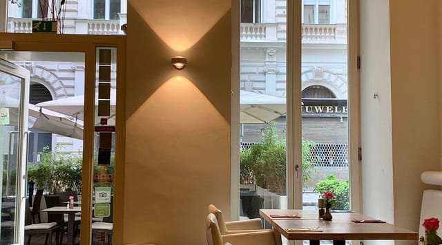 Modern restaurant event space with architectural lighting for networking breakfasts and meetings.