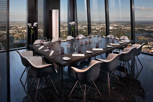Modern private dining room with floor-to-ceiling views for executive meetings and VIP dinners.