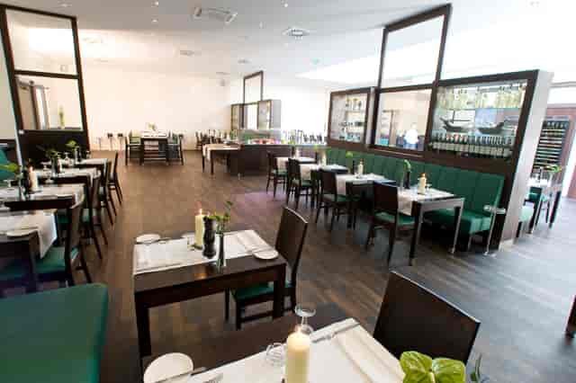Contemporary dining venue with banquette seating for corporate dinners and private events.