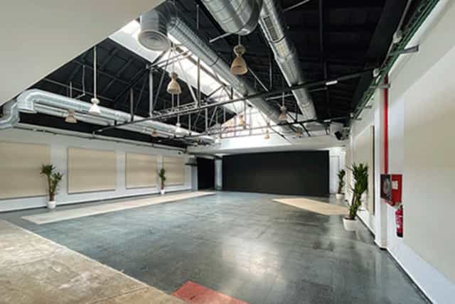 Industrial-chic event venue with high ceilings for creative workshops and product launches.