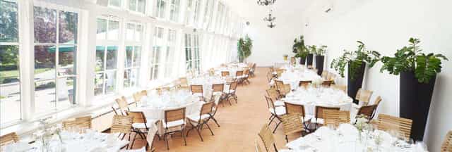 Sun-drenched Europahaus Wien bistro with banquet seating for weddings and corporate events.