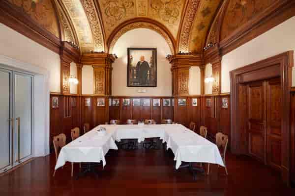Historic U-shape boardroom at Hotel Regina for executive meetings and seminars.