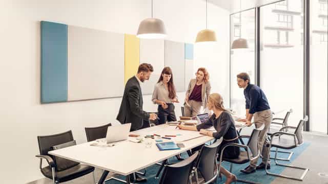 Ergonomic conference room with breakout layout for collaborative business meetings and workshops.