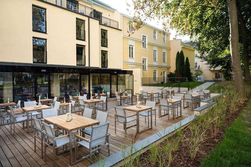 Hotel Maximilian garden terrace for outdoor corporate events, receptions, and networking.