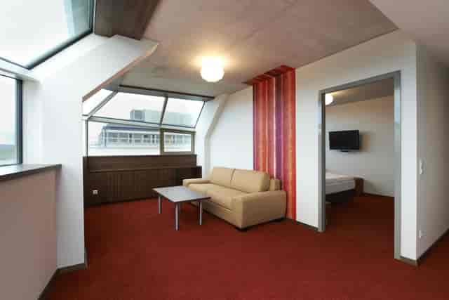 Executive boardroom suite with natural light for VIP strategy meetings and corporate events.