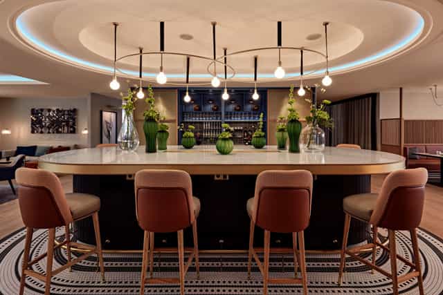 Modern Hilton Vienna Park breakout space for corporate networking and upscale event receptions.