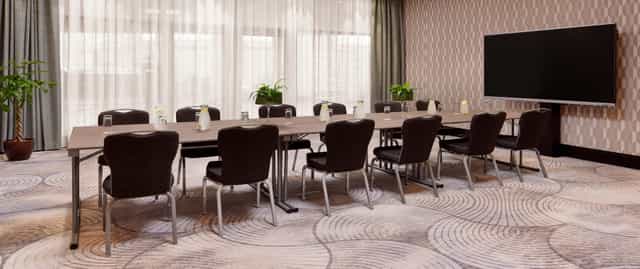 Boardroom setup at Hilton Vienna Park, ideal for corporate meetings and professional events.