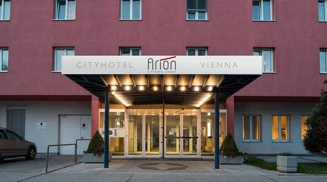 Arion City Hotel entrance, functional facade, ideal for corporate event logistics and business stays.