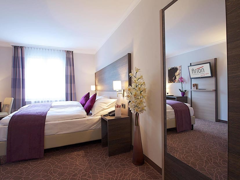 Standard Arion City hotel room with media desk for corporate business travel.